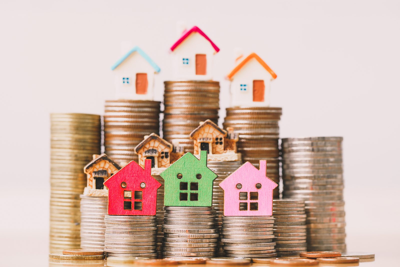 How much does it cost to buy a house? 2 bigstock house model on coins stack pl 320985004